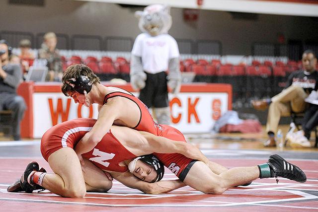 N.C. State's sophomore Brian Hamann wrestles against No. 7 Nebraska's Justin Arthur Saturday, Nov. 22, 2014. Hamann won 7-3 by decision in the Wolfpack's 16-15 loss to the Cornhuskers at Reynold's Coliseum.