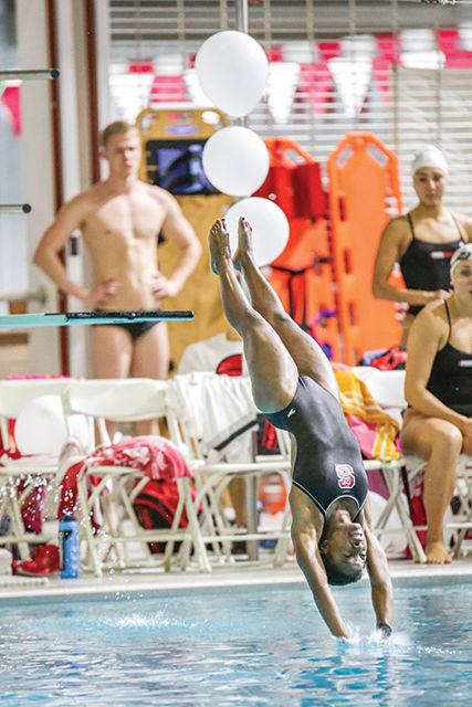 Sophomore Gabrielle McDermott completes a dive during the Red, White, and Black scrimmage. The scrimmage took place Friday, September 26th, 2014. Photo by Nick Faulkner.