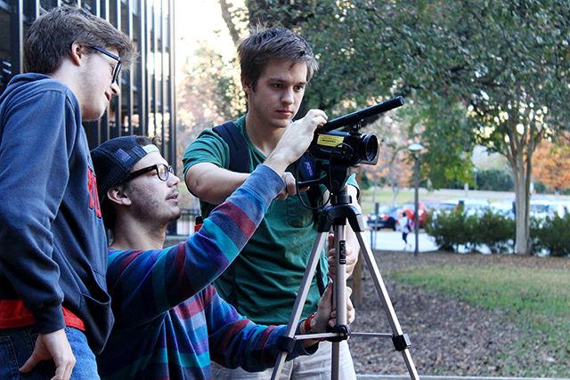 Josh Anderson, a sophomore studying computer engineering (cinematographer), Justin Reagan, a sophomore studying computer science (writer and director) and Jordan Powell, a sophomore studying electrical engineering (actor) set up their equipment as they film near Bragaw Residence Hall on Nov. 11. The crew was making a parody of MTV Cribs for the Campus MovieFest, which is set to release today.