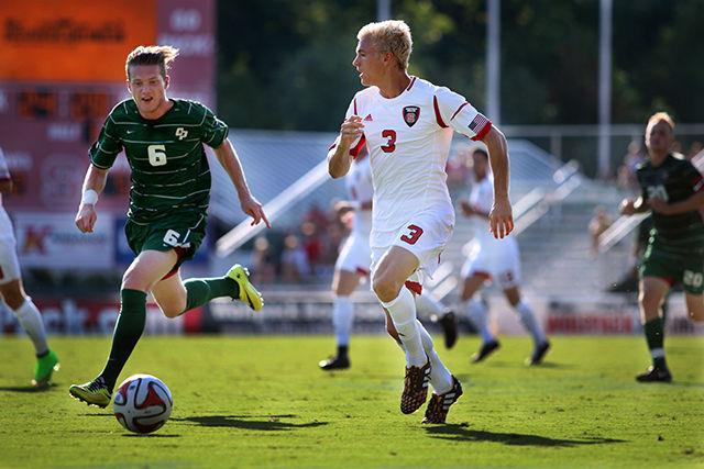 Freshman defender Caleb Duvernay moves the ball down the field during the game against the Cal Poly Sunday, Aug. 31. The Wolfpack fell to the Mustangs 3-1 at Dail Soccer Field.&#160;