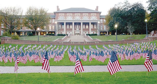 American flags dot the western end of the Court of North Carolina Monday evening. The 1,191 flags, each representative of an NC State veteran, were placed on campus this past weekend by the Student Veterans Association in celebration of Veterans Day, one week from today.