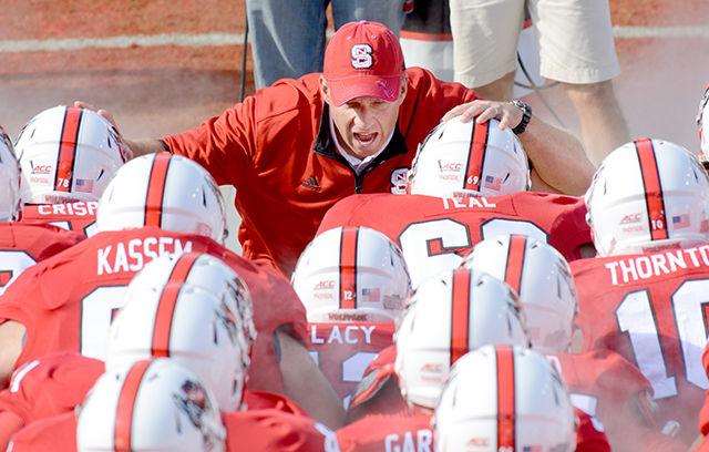 Head coach Dave Doeren pumps up his team before taking the field for the game against Boston College Saturday, Oct. 11, 2014. The Wolfpack fell to the Eagles, 30-14. Despite recruiting well, Doeren has been unable to lead N.C. State to a conference victory since taking over from former head coach Tom O'Brien at the start of the 2013 season. Photo by John Joyner.