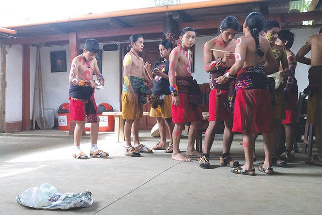 Members of the cultural group Sotz&#8217;il Jay paint each other to prepare for the Maya ball game in their cultural center outside of Solol&#225;, Solol&#225; Guatemala in June 2014. Students in the Ethnographic Field School had the opportunity to visit with Sotz&#8217;il Jay to learn about traditional Maya arithmetic, music, rituals, and dance.