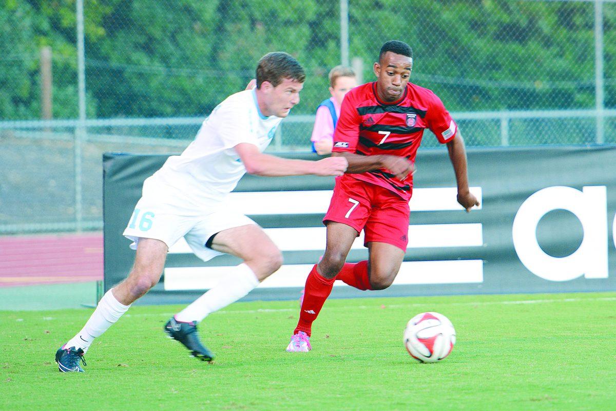 Senior defender Matt Ingram battles for position of the ball with UNC-Chapel Hill's Rob Lovejoy Friday evening, Oct. 17, 2014, at Dail Soccer Stadium. Ingram and the rest of the Pack defenders put up a solid effort during the game, but the rival Tarheels emerged victorious at the end of 90 minutes, winning 1-0. The loss takes the team to 5-5-3 on the season and 1-3-2 in the ACC.