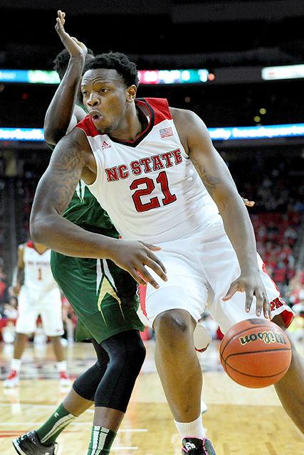 Sophomore forward BeeJay Anya drvies to the basket during the game against South Florida Sunday, Nov. 23, 2014. Anya had nine rebounds and five blocks in the Wolfpack's 68-65 win over the Bulls at PNC Arena.