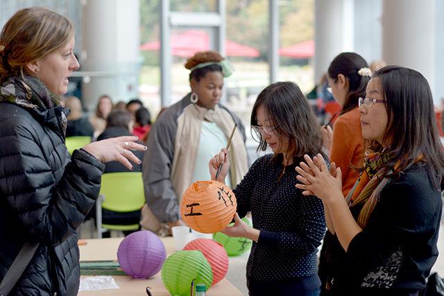 Students interact with members of the Confucius Institute and learn more about Chinese traditions at the event held in Talley to celebrate the 10th anniversary of the Confucius Institute Tuesday. They took home customized lanterns and enjoyed free food at the event.