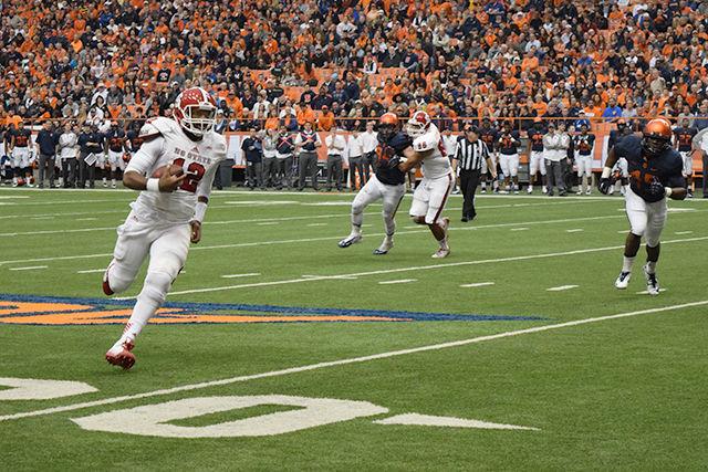 Redshirt quarterback Jacoby Brissett escapes pressure and rolls out of the pocket to gain a first down for the Pack inside the red zone on Saturday. Brissett was dealt a late hit out of bounds, which put NC State in scoring position on the 5-yard line. State, however, did not score the touchdown.