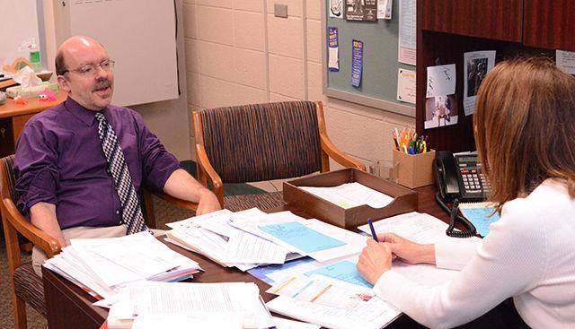 Chuck Small, former NC State graduate student who studied counseling from '09-'11, talks with Philomena Karol, also a former NC State graduate student, Tuesday, Dec. 2. Small worked as a copy-editor for the News and Observer(italics) for 15 years before coming to NC State to study counseling.