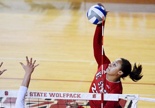 Senior outside hitter Dariyan Hopper spikes the ball against Georgia Tech on Nov. 9 in Reynolds Coliseum.