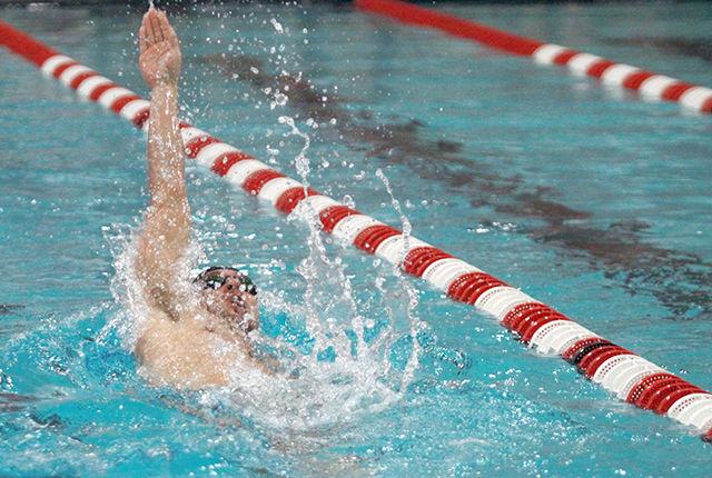 Junior Stephen Coetzer competes in the 200-yard backstroke Feb. 1 at the Willis R. Casey Aquatic Center. Coetzer finished second, just behind UVA&#8217;s Luke Papendick, with a time of 1:47.61.&#160; The NC Stated men squeaked out a win against the &#8216;Hoos 157-141.
