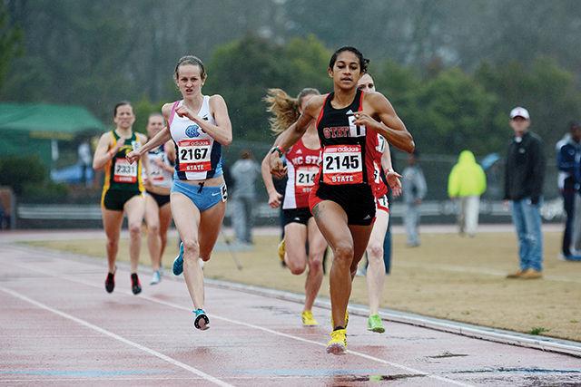 Red Shirt Ryanna Henderson sprints for the finish of the women's 200 meter dash. Ryanna finished in ninth place with a time of 2 minutes and 13.97 seconds. The 2014 Raleigh Relays were held at Dale Soccer Field Friday and Saturday. Photo by Joseph Phillips