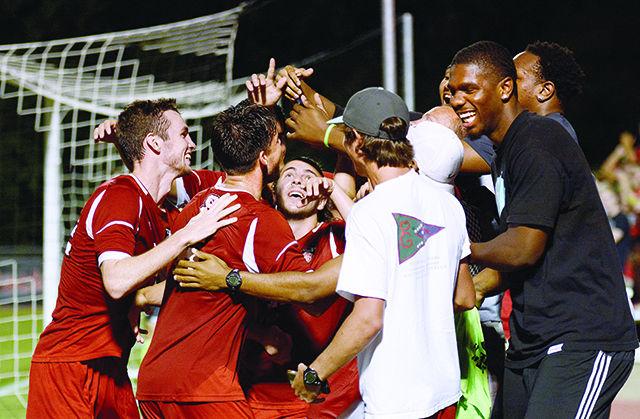 After scoring NC State's first goal of the game, sophomore midfielder Michael Bajza celebrates with some of his fellow soccer and basketball players. The Wolfpack defeated the Campbell Camels 2-0 at Dail Soccer Field on Wednesday, Aug 20, 2014. Photo Joseph Phillips