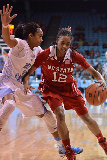 Junior guard Krystal Barrett fights her way into the paint during the game against North Carolina in Chapel Hill Jan. 9, 2014. Barrett had eleven points and seven rebounds in the Wolfpack&#8217;s 79-70 loss to the Tar Heels.