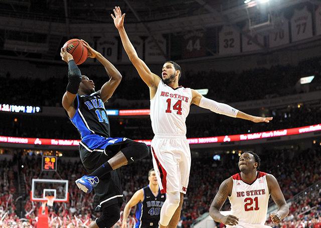 Freshman forward Caleb Martin jumps to block a shot from No. 2 Duke Sunday, Jan. 11. Caleb played two minutes in the Wolfpack's 87-75 win over the Blue Devils at PNC Arena.