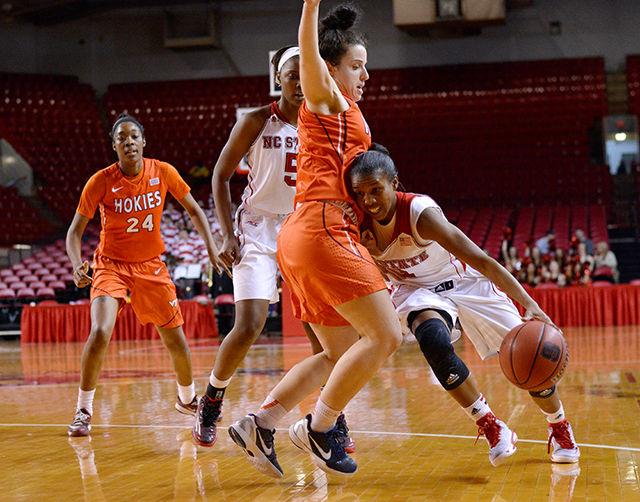 Redshirt senior guard Len'Nique Brown-Hoskin drives through Virginia Tech defender Vanessa Panousis Thursday in Reynolds Coliseum. Brown-Hoskin finished shooting 33 percent from the field with 9 points. The Wolfpack improved to 10-5 on the regular season after defeating the Hokies 73-59.