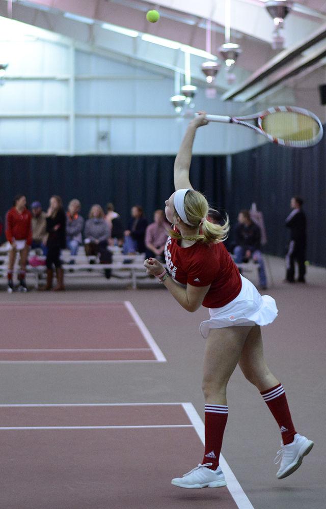 Freshman Liza Fieldsend serves the ball against East Carolina. The Wolfpack won 7-0 over the Pirates sealing their double header win. Photo by Joseph Phillips