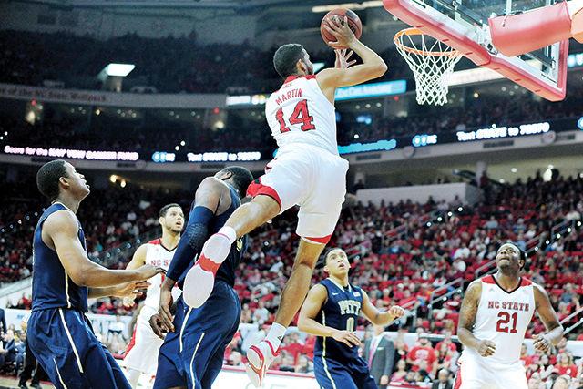 Freshman forward Caleb Martin jumps for a layup during the game against Pittsburgh Jan. 3, 2014. Caleb had two points and one block in the Wolfpack's 68-50 win over the Panthers at PNC Arena.