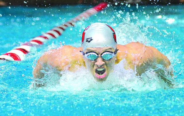 Junior Christian McCurdy rips down the lane during the 200yd butterfly at NC State's meet with rival UNC-Chapel Hill Saturday at the Casey Aquatic Center. McCurdy finished first in the event with a time of 1:44.68. The No. 8 Wolfpack men's team remained undefeated, beating the No. 20 Tar Heels 180-118. The No. 12 women's team just barely missed topping the No. 5 Tar Heel women, 146.5-134.5.