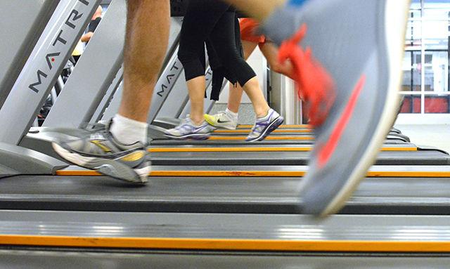 Gym goers run on treadmills in the front exercise room of Carmichael Gymansium Feb 9. Renovations on this room is will take place in May and the room will double in size.