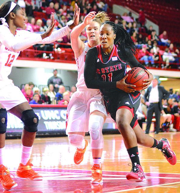 Jennifer Mathurin, sophomore forward for the Wolfpack, defends the ball against opponent Makayla Johnson at the basketball game against Clemson on Jan. 10 at Reynolds Coliseum. Mathurin was in play for 24 minutes. The Wolfpack beat Clemson 76-50.