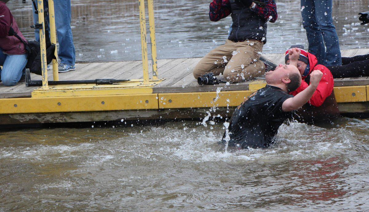 Dozens of "plungers" braved the icy waters og Lake Raleigh Saturday morning, Feb. 21, 2015 for the 2015 Polar Plunge. The annual event is hosted to raise funds for Special Olympics North Carolina. This year's groups raised more than $14,000 for the cause.