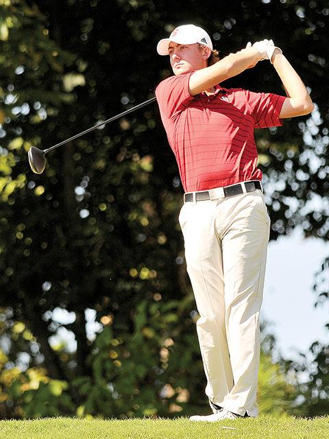 Redshirt sophomore Stanhope Johnson takes a practice swing before teeing off of the 16th hole at Lonnie Poole Golf Course Oct. 6 during round one of the Wolfpack Intercollegiate. The Wolfpack ended the first round in first place with a team score of 283.&#160;