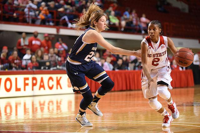 Redshirt senior guard Len'Nique Brown-Hoskin drives around a defender during the women's basketball Senior Day game against No. 4 Notre Dame in Reynolds Coliseum Sunday. The Wolfpack women fell to the Fighting Irish, 67-60, in the final public event held in Reynolds Coliseum before the start of renovations.