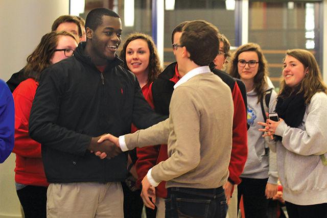 Student body presidential candidate Khari Cyrus shakes hands with student body presidential candidate Chris Becker. Cyrus and his running mate Nate Bridgers will move on to a runoff election Thursday along with the Gavin Harrison-Meredith Mason ticket. Becker and his running mate, Kelly Elder, will not move on to the run off