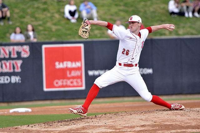 Brad Stone, a junior and left fielder for the NC State baseball team pitches the ball against opponent UNC-Greensboro at the game held Wednesday at Doak Field. The Wolfpack won 8-3.