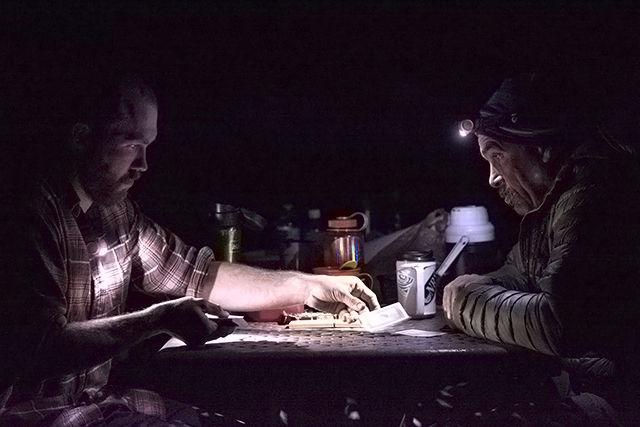 Alex Davis, a senior studying electrical engineering, plays cribbage with Terry Dash, outdoor recreation instructor and director of NC State's outdoor leadership program, Saturday evening at their campsite along the New River just outside of Fayetteville, WV. Davis, along with nine other students in Dash's whitewater rafting course, spent the weekend putting the skills they had learned in class to the test on the rapids of the New. "It was nice to relax after a long day of paddling," said Davis in regard to the card game.