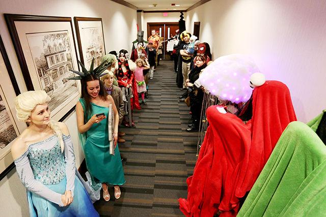 Nick Faulkner/Technician
Lauren Fellows, a senior studying graphic design, dressed as Elsa from &#8220;Frozen&#8221; and Natasha Marrero, a senior studying art, dressed as Gracie Hart, wait in line for a cosplay contest at Oak City Comic Show on Sunday. The Oak City Comic Show drew hundreds of attendees in its first year, many of whom dressed up and attended both fan and celebrity panels.
&#160;