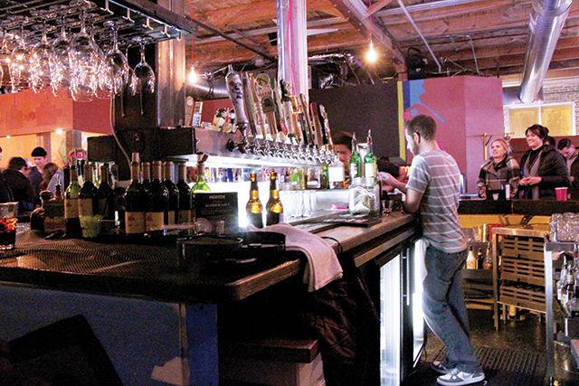 Jason Kenny, one of the bartenders at the Boxcar Bar + Arcade, punches the order of one of the customers. The very friendly bartenders make sure the fast services to the customers while they enjoy playing on different game stations.