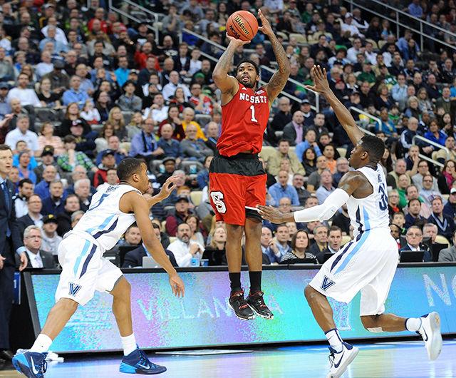 Redshirt junior guard Trevor Lacey shoots a three-pointer at the buzzer to end the first half of NC State's 3rd round game of the NCAA Tournament against Villanova Saturday. Lacey had 17 points in the Wolfpack's 71-68 win over the No. 1 seed Wildcats at CONSOL Energy Center in Pittsburgh, PA.