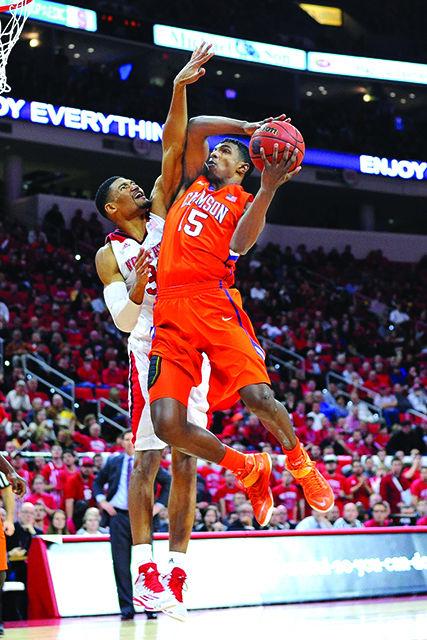 Sophomore forward Kyle Washington jumps to block a layup during the game against Clemson Wednesday, Jan. 28, 2015. The Wolfpack fell to the Tigers 68-57 at PNC Arena.