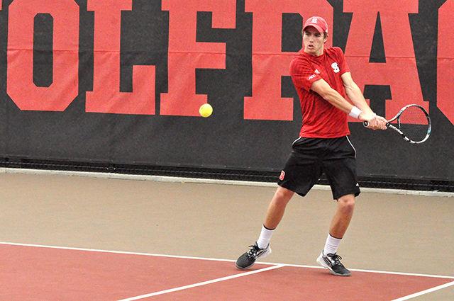 Sophomore Ian Dempster returns a serve from his Virginia Tech opponent in doubles with Senior Robbie Mudge at J. W. Isenhour Tennis Center on March 22, 2015. The pair lost the doubles match from a 7-5 tiebreaker. The Wolfpack lost the meet 4-3 to the 16th-ranked Hokies at J. W. Isenhour Tennis Center on March 22, 2015. Photo by Sorena Dadgar
