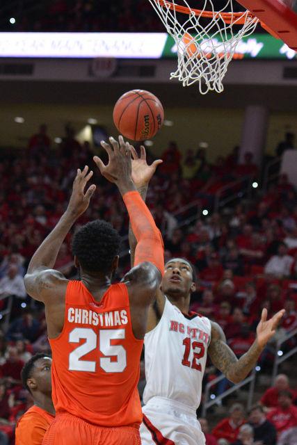 The N.C. State men's basketball team defeated the Syracuse Orange Saturday, March 7, 2015 at PNC Arena 71-57. With the win against the Orange the Wolfpack clenched a number 7 seed in the ACC tournament.