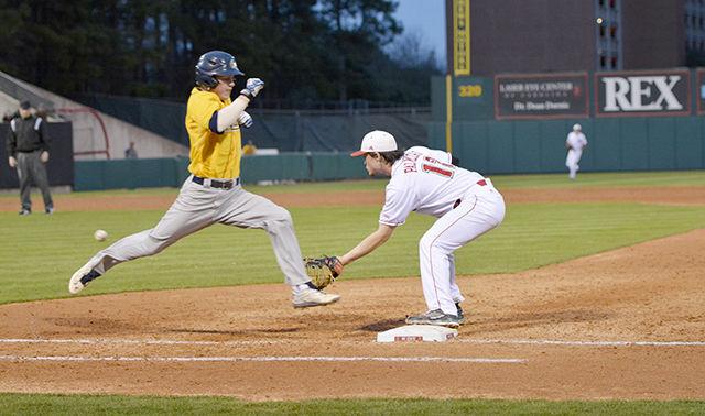 Preston Palmeiro, a sophomore and first baseman for the Wolfpack men&#8217;s baseball team&#160; tries to tag the opponent from UNC-Greensboro at the baseball game held on March 18 at the Doak baseball field.