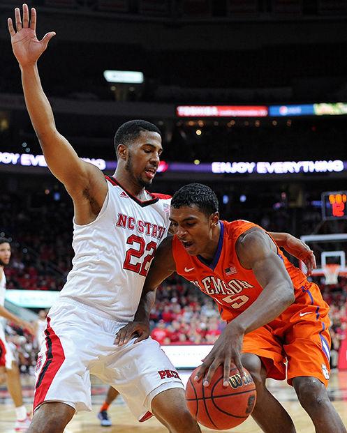 Redshirt senior guard Ralston Turner defends against Clemson freshman forward Donte Grantham during the game against Clemson Jan. 28. The Wolfpack fell to the Tigers 68-57 in PNC Arena.