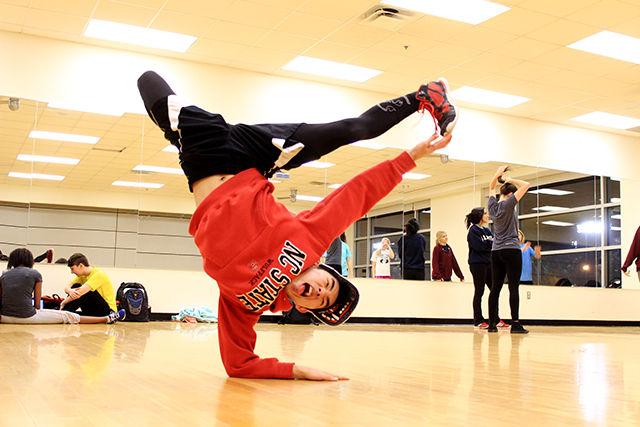 Patrick Hoon, a junior studying Mechanical Engineering does a L-Kick Elbow Freeze during a practice dance class in Rec Centre&#160;on Tuesday&#160;evening. "I watched this crew called Super Cr3w on America's best dance crew. They were really good break dancers. I tried it in my freshman year and everyone though I would fail miserably. But I taught myself by mimicking the dancers on these shows", said Hoon when asked about how he started break dancing. Hoon has performed at several events around Raleigh. He also taught himself popping, locking and tutting. Currently, he is a part of NC State Dance group " The Productions", &#160;which recently participated in a dance competition&#160;"Prelude Carolinas"&#160;in Durham.