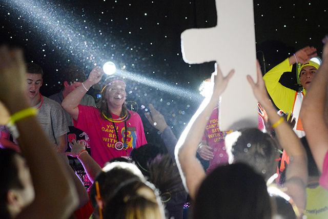 Chamberlain Collier, a senior studying political science with a law and justice concentration, dancing on stage during Rave Hour of the Dance Marathon on Friday in the Talley Ballroom. Collier's personal fundraising contribution was $3,259, far more that her original goal of $2,000. The contributions came from a wide range of friends and family. Dance Marathon is a yearlong fundraising effort for the Children's Miracle Network Hospital, Duke Children's Hospital and Health Center in Durham, NC. photo by Gavin Stone