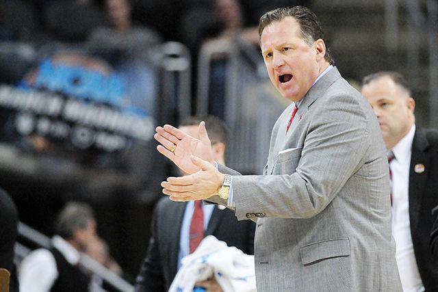 Head coach Mark Gottfried claps his hands during a timeout in the 2nd round game of the NCAA Tournament against LSU Thursday, March 19, 2015. Gottfried's Wolfpack defeated the Tigers 66-65 off of a last second shot by sophomore forward BeeJay Anya at CONSOL Engergy Center in Pittsburgh, PA.