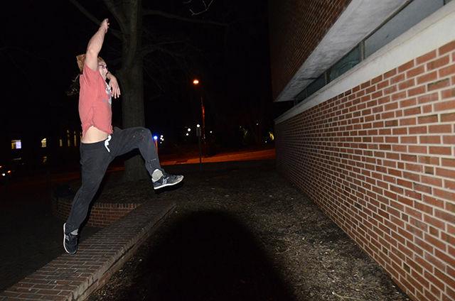 Thomas Podbesek, a senior in Material Science Engineering, leaps toward a wall on March 4 so he can cat hang. Podbesek is a senior officer in the Parkour and Freerunning Club at State. "I enjoy the movement the most" said Podbesek as he described his passion for freerunning.