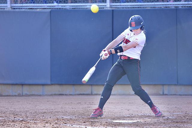 Lana Van Dyken, junior and third baseman for the N.C. State softball team performs a hit against opponent Florida State at the softball game that took place on Friday, 3rd April in the Dail baseball field. Wolfpack lost game one 6-5 to Florida State.
