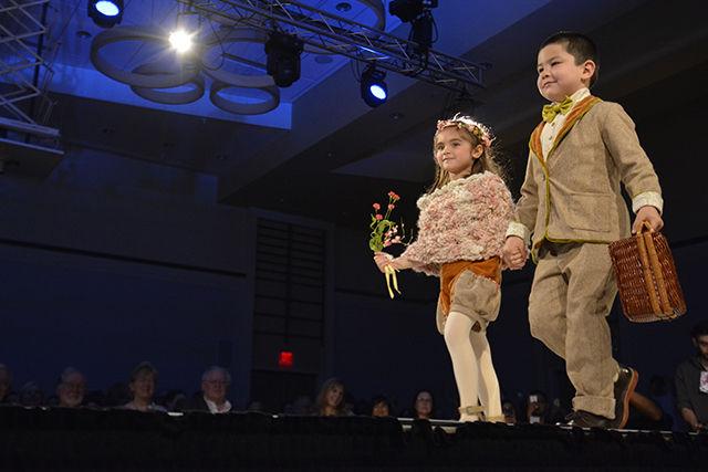 Lucy Hill and Colton Newkirk model "Bloom" a line designed by Morgan Cox, Senior in Art and Design, for the Art2Wear Fashion Show in Talley Student Union Ballroom April 17."Bloom" was inspired a by the childhood fantasies she created when playing outside.
