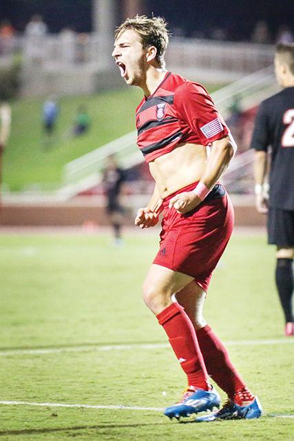 After a goal in the 52nd minute assisted by Connor Donovan, sophomore forward Travis Wannemuehler celebrates as he runs to join his team on the sideline. The Wolfpack beat Louisville, 2-1, Oct. 3, 2014 in Dail Soccer Stadium in front of 681 fans.