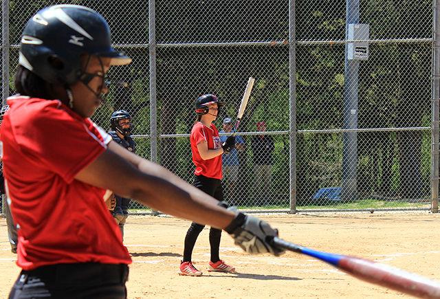Junior center-fielder Rebecca Jolly lines up the stance while right-fielder Nicole Shepherd warms up during a non-conference softball match against Radford on Sunday at Dail Softball Stadium. Red-shirted Jade Davis, a sophomore studying animal science, is excited to be on the team. "It's awesome. The girls are great. I came from Georgia, I am actually a transfer student, and I wanted to play softball. So I asked coach and he took me in," Davis said.