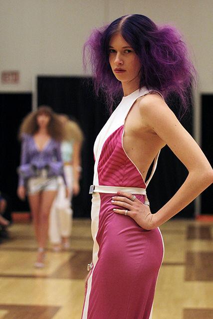 Emma Frank, a junior studying French, poses in a dress from a collection titled Lucid at the end of the runway during Art to Wear on April 25, 2014, in Talley Student Union.