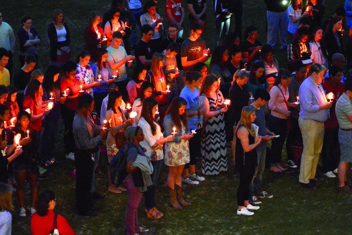 Members of the wolfpack hold a moment of silence and cherish the memories of Olivia Spurlock at the candellight vigil held in harris field on Monday evening. Friends and aquaintances of Olivia shared fond memories of her at the vigil and encouraged people to reach out to those in need. Olivia was a sophomore in mechanical engineering and one of the RA's of Sullivan.