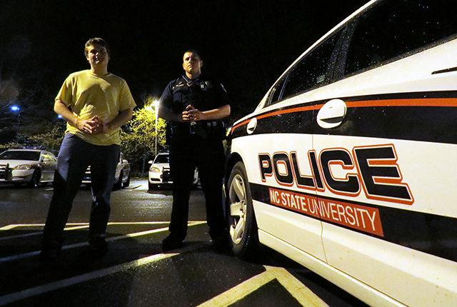 Officer David Green and Technician staff writer Russell Ash, a senior studying English, after their ride-along on Thursday night. The Campus Police Department offers the Ride Along program as a way to &#8220;increase understanding between officers in the Campus Police Department and the University community&#8221; and to serve as means to educate the community, according to the department&#8217;s webpage.