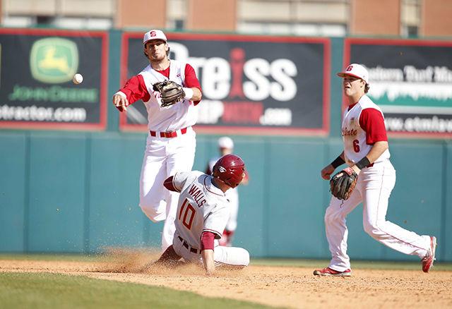 Senior second baseman Logan Ratledge and senior shortstop Joel McKeithan field a double play in the fifth inning of Saturday&#8217;s contest against the Florida State Seminoles. The Wolfpack defeated the Seminoles 11-7 in the game, helped by an offensive showcase from the NC State batting order, which tallied 19 hits and four home runs in the contest. &#160;